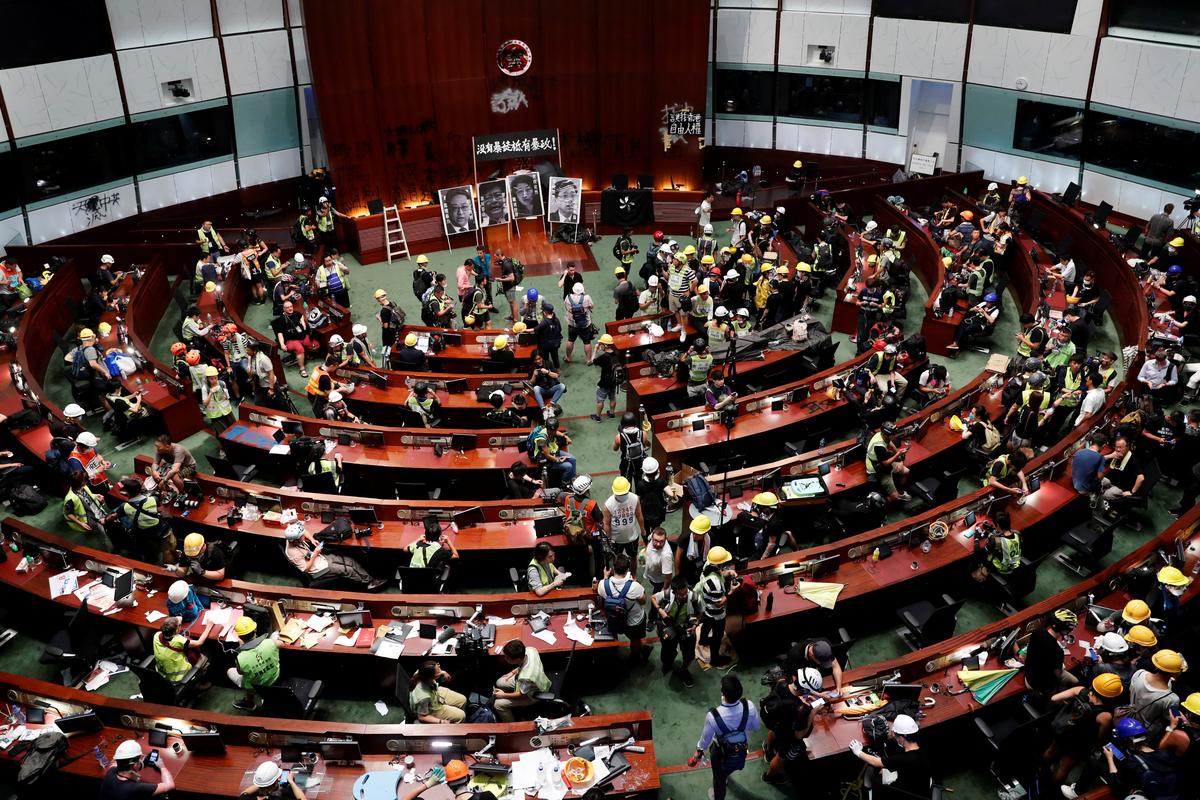 Hong Kong protesters smash up legislature in direct challenge to China.